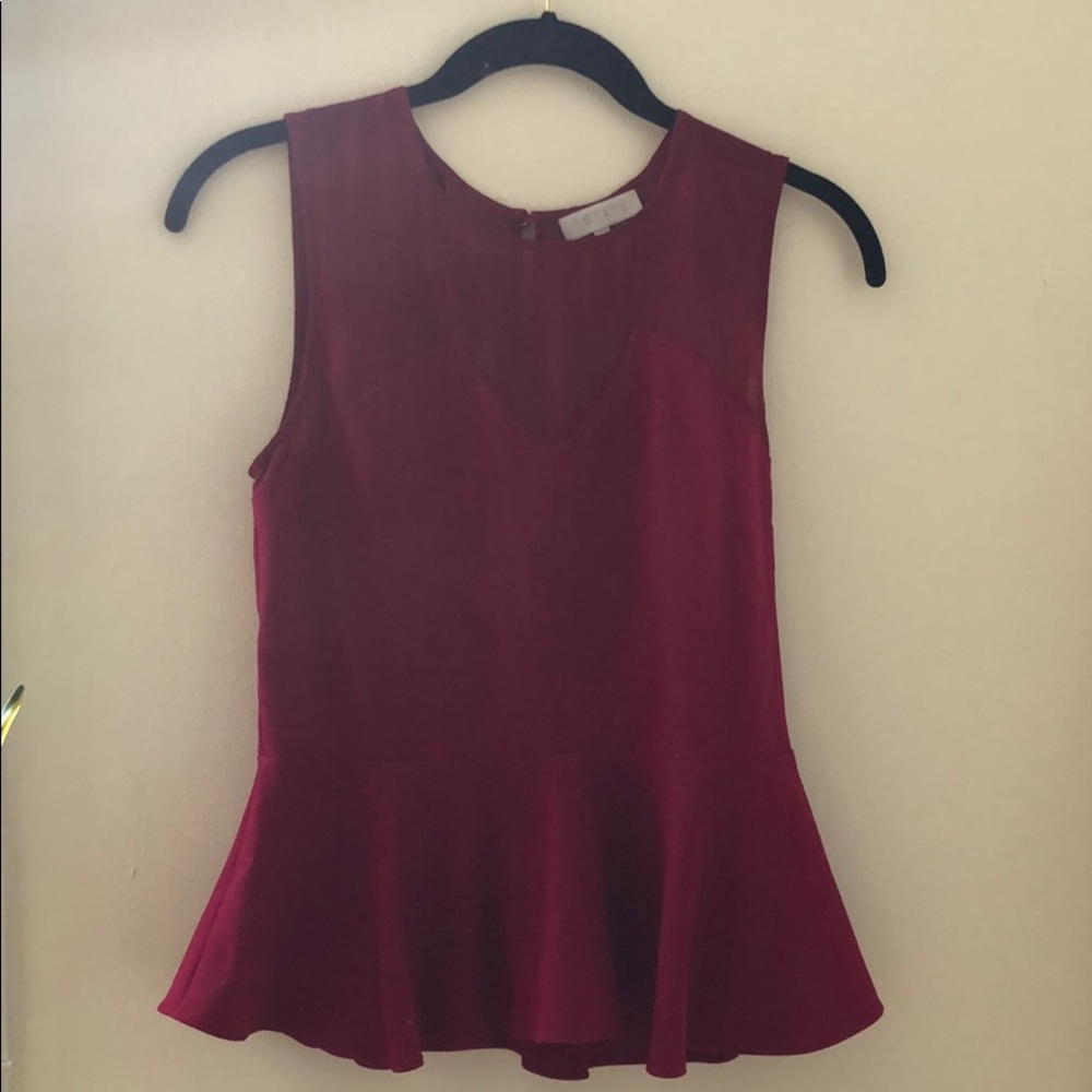 Peplum sleeveless top with sheer detail